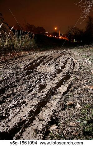 tyre tracks in field at night View Large Photo Image Picture - tyre tracks in field at night. Fotosearch