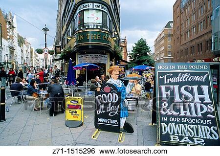 U K, Britain, England, London, Mayfair, pub, fish & chips, street scene View Large Photo Image Stock Photograph - U K, Britain, England, London, Mayfair, pub, fish & chips, street scene. Fotosearch