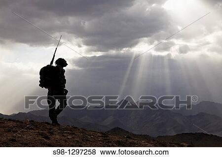 U S Army Spc Newton Carlicci travels dismounted while on his way back to his outpost from the village of Paspajak, Charkh District, Logar province, Afghanistan, June 20 View Large Photo Image Stock Photo - U S Army Spc Newton Carlicci travels dismounted while on his way back to his outpost from the village of Paspajak, Charkh District, Logar province, Afghanistan, June 20 . Fotosearch