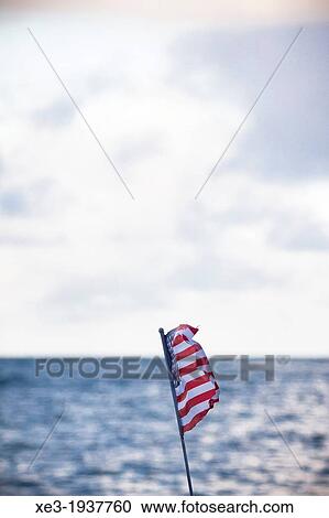 Stock Image - U. S. flag waving, Oahu, Hawaii. Fotosearch