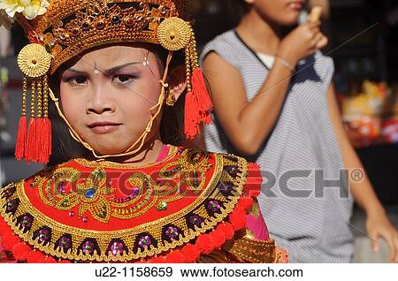 Ubud (Bali, Indonesia): a girl dressed up in traditional Balinese clothes for a children show View Large Photo Image Stock Photo - Ubud (Bali, Indonesia): a girl dressed up in traditional Balinese clothes for a children show. Fotosearch