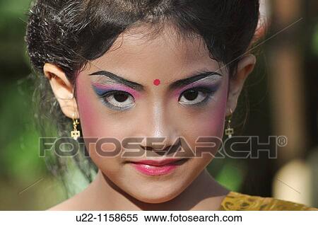 Stock Photography - Ubud (Bali, Indonesia): a girl dressed up in traditional Balinese clothes for a children show. Fotosearch