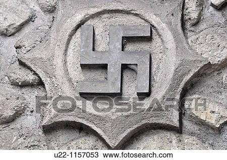 Stock Image - Ubud (Bali, Indonesia): an Hindu swastika at a home entrance. Fotosearch