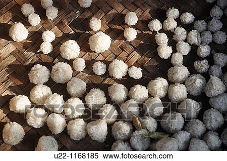 Ubud (Bali, Indonesia): rice balls, left to dry under the sun, to be used as offerings to the spirits by Hindu believers View Large Photo Image Stock Photography - Ubud (Bali, Indonesia): rice balls, left to dry under the sun, to be used as offerings to the spirits by Hindu believers. Fotosearch