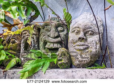 Ubud, Bali, Indonesia, weathered stone sculptures at an Ubud backyard. View Large Photo Image Stock Photo - Ubud, Bali, Indonesia, weathered stone sculptures at an Ubud backyard.. Fotosearch