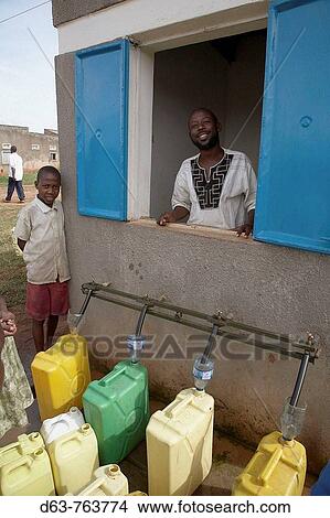 UGANDA Manelling safe drinking water, Nakifuma village, Mukono District View Large Photo Image Picture - UGANDA Manelling safe drinking water, Nakifuma village, Mukono District. Fotosearch