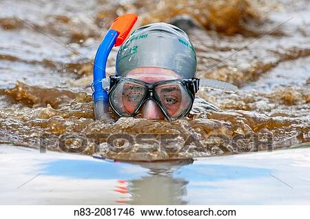 UK. 25th August 2013. The annual World Bogsnorkelling Championship is held every August Bank Holiday at the famous Waen Rhydd Bog. in the Welsh foothills of the Cambrian Mountains near the smallest town in Britain renowned for its quirky sports. View Large Photo Image Stock Photograph - UK. 25th August 2013. The annual World Bogsnorkelling Championship is held every August Bank Holiday at the famous Waen Rhydd Bog. in the Welsh foothills of the Cambrian Mountains near the smallest town in Britain renowned for its quirky sports.. Fotosearch
