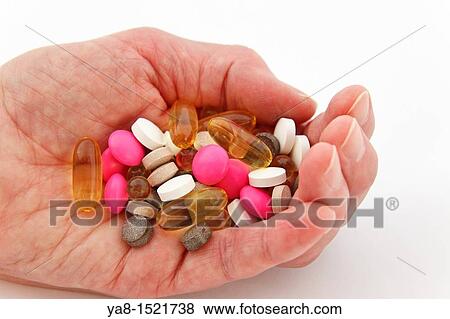 UK, Britain, Europe Elderly woman holding a selection of prescription and supplement pills in the palm of one hand View Large Photo Image Stock Photo - UK, Britain, Europe Elderly woman holding a selection of prescription and supplement pills in the palm of one hand. Fotosearch