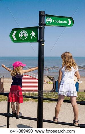 UK, England. Kent, Whitstable. Tankerton Beach, children on railings View Large Photo Image Stock Image - UK, England. Kent, Whitstable. Tankerton Beach, children on railings. Fotosearch