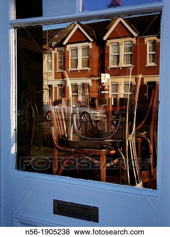 Stock Photo - UK, England, London, Chairs on table in bar in Chiswick. Fotosearch