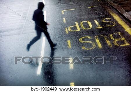 UK, England, London, Man running across street View Large Photo Image Stock Photo - UK, England, London, Man running across street. Fotosearch