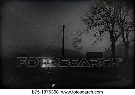 UK, England, North Yorkshire, Yorkshire Dales, country road, car headlights View Large Photo Image Stock Photo - UK, England, North Yorkshire, Yorkshire Dales, country road, car headlights. Fotosearch