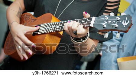 Ukulele musician performing in New York View Large Photo Image Stock Image - Ukulele musician performing in New York. Fotosearch