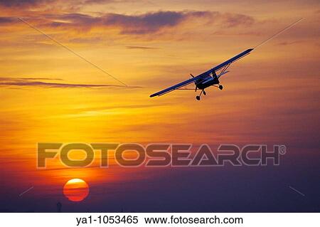 Ultra light aircraft Eurofox turning on a sunset sky Sarreguemines, Moselle, Lorraine, France View Large Photo Image Stock Photography - Ultra light aircraft Eurofox turning on a sunset sky Sarreguemines, Moselle, Lorraine, France. Fotosearch