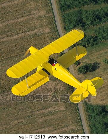 Ultra light biplane Kiebitz flying over France View Large Photo Image Stock Image - Ultra light biplane Kiebitz flying over France. Fotosearch