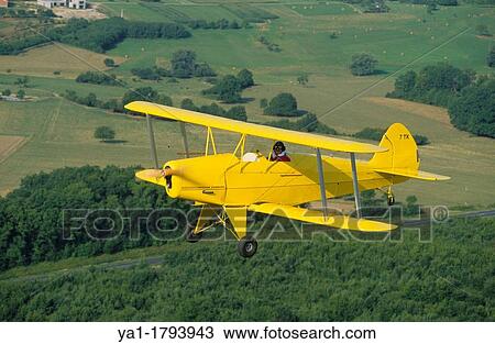 Ultra light biplane Kiebitz flying over France View Large Photo Image Stock Image - Ultra light biplane Kiebitz flying over France. Fotosearch