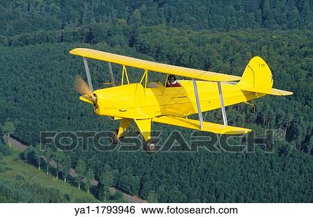 Ultra light biplane Kiebitz flying over France View Large Photo Image Stock Photograph - Ultra light biplane Kiebitz flying over France. Fotosearch
