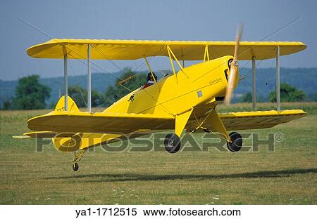 Ultra light biplane Kiebitz landing, France View Large Photo Image Stock Photography - Ultra light biplane Kiebitz landing, France. Fotosearch