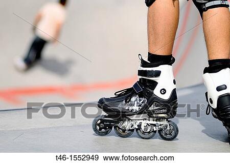 Stock Photo - Um skate boots sport in Rio Madrid. Fotosearch