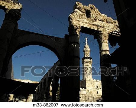 Stock Photo - Umayyad Mosque minaret and ruins of the Roman temple of Jupiter, Damascus, Syria. Fotosearch