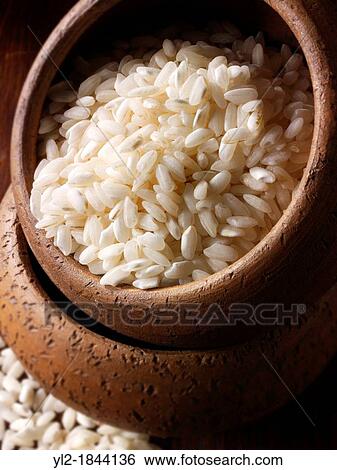 Un-cooked raw white rice View Large Photo Image Stock Photograph - Un-cooked raw white rice. Fotosearch
