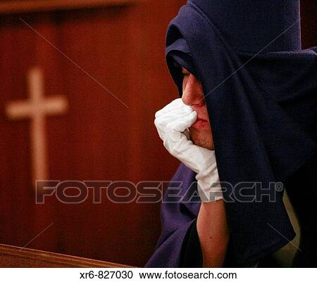 Stock Image - Una penitente en una procesi? n de la Semana Santa de Granada, Andaluc? a, Espaa., A penitent in a procession of Holy Week in Granada, Andalucia, Spain.. Fotosearch