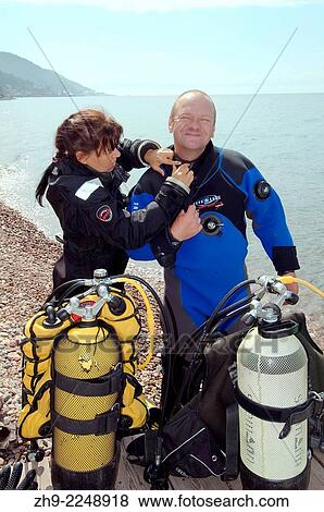 Stock Photo - Underwater artist Yuriy Alexeev (Yuri Alekseev) wears scuba gear for drawing pictures under water. Lake Baikal, Listvyanka, Irkutsky District, Irkutsk Oblast, Siberia, Russia, Eurasia.. Fotosearch