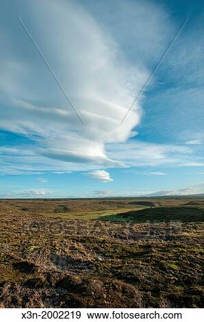 uneven ground with blue cloudy sky, Chile, south america. View Large Photo Image Stock Photo - uneven ground with blue cloudy sky, Chile, south america.. Fotosearch
