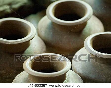 Stock Photo - Unfinished clay pots made by local artisans in Dzongsar in Kham, Tibet. Fotosearch