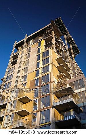 Unfinished residential condominium building, Old Montreal, Quebec, Canada. View Large Photo Image Stock Photo - Unfinished residential condominium building, Old Montreal, Quebec, Canada.. Fotosearch