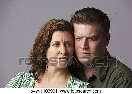 Unhappy married couple feeling anger and disappointment View Large Photo Image Stock Image - Unhappy married couple feeling anger and disappointment. Fotosearch
