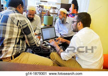 United Arab Emirates, U A E, UAE, Middle East, Dubai, Deira, Al Rigga Road, Hotel ibis Al Rigga, hotel, lobby, Asian, man, migrant worker, foreign laborer, laptop, computer, business, doing, deal, Pakistani, View Large Photo Image Stock Image - United Arab Emirates, U A E, UAE, Middle East, Dubai, Deira, Al Rigga Road, Hotel ibis Al Rigga, hotel, lobby, Asian, man, migrant worker, foreign laborer, laptop, computer, business, doing, deal, Pakistani,. Fotosearch