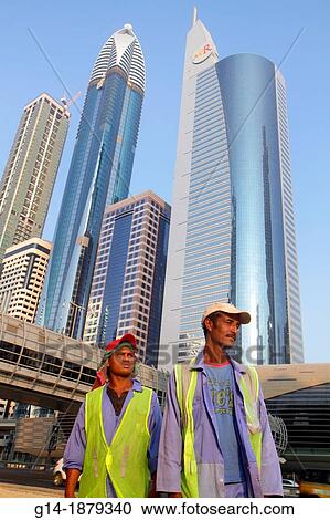United Arab Emirates, U A E, UAE, Middle East, Dubai, Trade Centre, Sheikh Zayed Road, Asian, man, migrant worker, foreign laborer, job, construction, Bangladeshi, Rose Tower, Al Ghaya Tower, Ahmed Abdul Rahim Al Attar Tower, 21st Century, skyscraper, View Large Photo Image Stock Image - United Arab Emirates, U A E, UAE, Middle East, Dubai, Trade Centre, Sheikh Zayed Road, Asian, man, migrant worker, foreign laborer, job, construction, Bangladeshi, Rose Tower, Al Ghaya Tower, Ahmed Abdul Rahim Al Attar Tower, 21st Century, skyscraper,. Fotosearch
