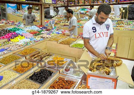 United Arab Emirates, U A E, UAE, Middle East, Dubai, Al Souqe Al Kabeer, Carrefour Hyper Market, shopping, grocery store, supermarket, Asian, man, migrant worker, foreign laborer, nuts, fruits, retail display, dry figs, employee, View Large Photo Image Stock Photo - United Arab Emirates, U A E, UAE, Middle East, Dubai, Al Souqe Al Kabeer, Carrefour Hyper Market, shopping, grocery store, supermarket, Asian, man, migrant worker, foreign laborer, nuts, fruits, retail display, dry figs, employee,. Fotosearch