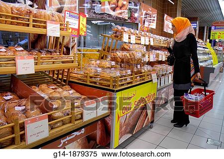 United Arab Emirates, U A E, UAE, Middle East, Dubai, Al Souqe Al Kabeer, Carrefour Hyper Market, shopping, grocery store, supermarket, for sale, bakery, bread, English, Arabic, language, Asian, woman, thawb, hijab, View Large Photo Image Stock Photography - United Arab Emirates, U A E, UAE, Middle East, Dubai, Al Souqe Al Kabeer, Carrefour Hyper Market, shopping, grocery store, supermarket, for sale, bakery, bread, English, Arabic, language, Asian, woman, thawb, hijab,. Fotosearch
