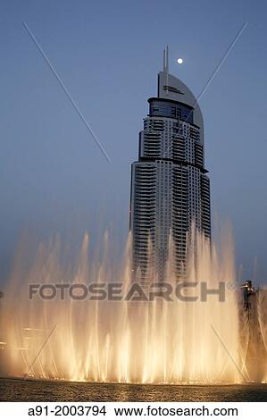 United Arab Emirates (UAE), Dubai, khakifa square and lake, luxury hotel The Address at back of the lake Khalifa, water works at sunset View Large Photo Image Picture - United Arab Emirates (UAE), Dubai, khakifa square and lake, luxury hotel The Address at back of the lake Khalifa, water works at sunset. Fotosearch