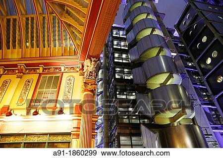 United Kingdom, city of London, trhe city financial district at night, Leadenhall Market gallery where after work on friday eve employees gather for drinking beer in the numerous pubs, the Lloyds head office architect Rogers 1978 View Large Photo Image Stock Photo - United Kingdom, city of London, trhe city financial district at night, Leadenhall Market gallery where after work on friday eve employees gather for drinking beer in the numerous pubs, the Lloyds head office architect Rogers 1978. Fotosearch