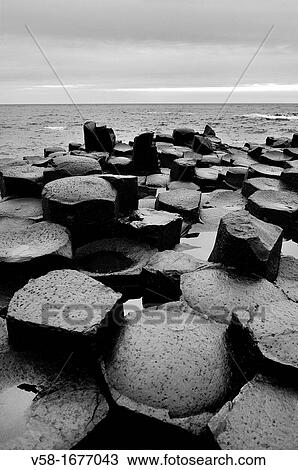 Stock Image - United Kingdom, Northern Ireland, Antrim coast, Giant's Causeway Legend has it that the Irish giant Fionn mac Cumhaill Finn McCool built the causeway to walk to Scotland to fight his Scottish counterpart Benandonner. Fotosearch