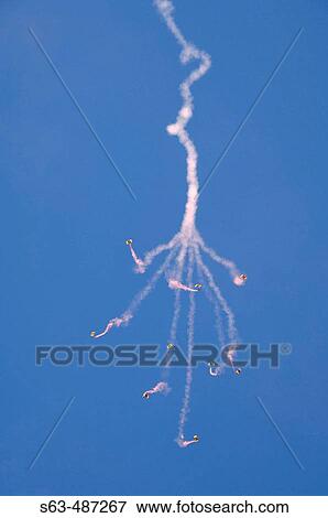 Stock Photo - United States ARMY Parachute Team members performing acrobatics at Edwards Air Force Base Open House and Air Show. Fotosearch