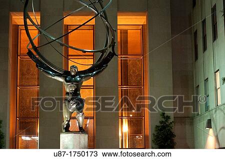 Stock Image - United States, New York City, Manhattan, Midtown, Rockefeller Center, Atlas Holding the World Sculpture at Night. Fotosearch