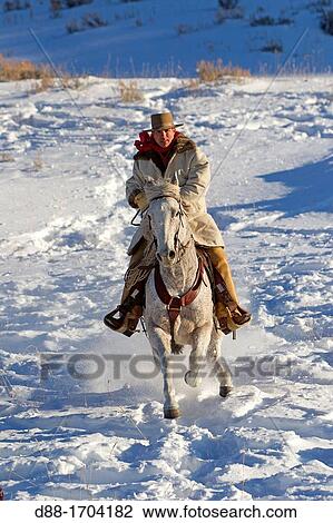 Stock Image - United States, Wyoming, Shell, The Hideout Guest Ranch, cowboy. Fotosearch