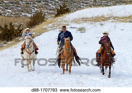 Stock Image - United States, Wyoming, Shell, The Hideout Guest Ranch, cow-boys. Fotosearch