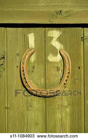 Unlucky number 13 with lucky horseshoe on wooden door on an allotment garden shed, Aberystwyth Wales UK View Large Photo Image Stock Image - Unlucky number 13 with lucky horseshoe on wooden door on an allotment garden shed, Aberystwyth Wales UK. Fotosearch