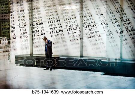 unrecognizable executive man talking on the phone with a graph economy in the background View Large Photo Image Stock Photo - unrecognizable executive man talking on the phone with a graph economy in the background. Fotosearch