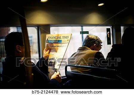 Unrecognizable executive, reading the Financial Times on a bus in London, England, UK, Europe. View Large Photo Image Stock Photo - Unrecognizable executive, reading the Financial Times on a bus in London, England, UK, Europe.. Fotosearch