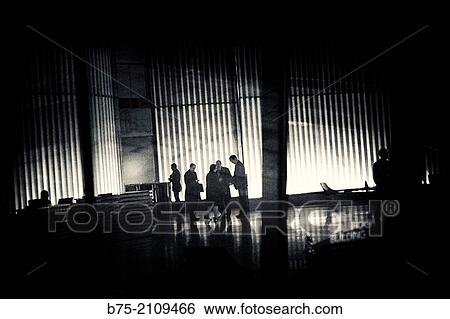 Unrecognizable Group of executives gathered at the entrance of an office. London, England, UK, Europe View Large Photo Image Stock Photograph - Unrecognizable Group of executives gathered at the entrance of an office. London, England, UK, Europe. Fotosearch