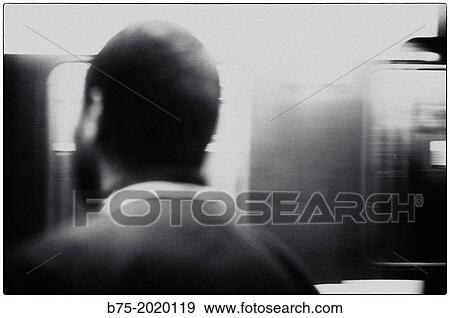 Unrecognizable man in motion, on the platform of a Paris metro station, France View Large Photo Image Stock Photo - Unrecognizable man in motion, on the platform of a Paris metro station, France. Fotosearch