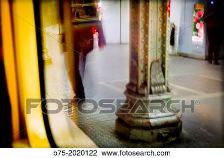 Unrecognizable man in motion, walking in a subway station in Paris, France View Large Photo Image Stock Image - Unrecognizable man in motion, walking in a subway station in Paris, France. Fotosearch
