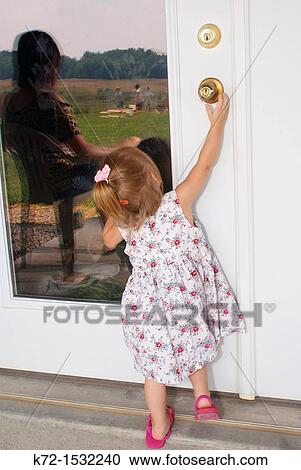 Unsupervised child tries to open a door View Large Photo Image Stock Image - Unsupervised child tries to open a door. Fotosearch