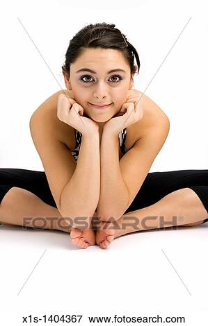 Up close wide shot of a dark haired girl with knees on the floor and feet together as she rests her chin on upturned hands and looks into camera. View Large Photo Image Stock Photo - Up close wide shot of a dark haired girl with knees on the floor and feet together as she rests her chin on upturned hands and looks into camera.. Fotosearch